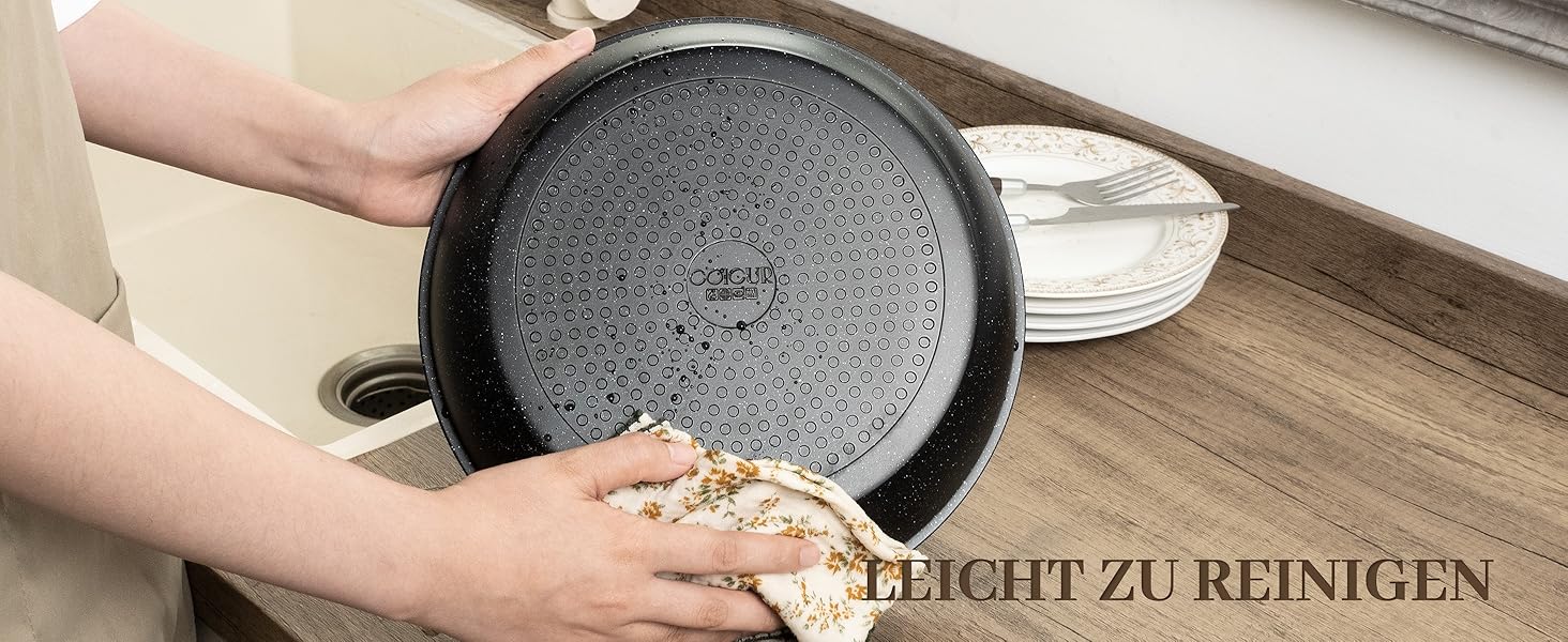 Набір посуду керамічний 23 предмети з антипригарним покриттям та знімними ручками, чорний. Підходить для всіх типів плит, включаючи індукційні. Сковороди 20/26 см, каструля 18 см, сотейник 24 см, жароміцний.