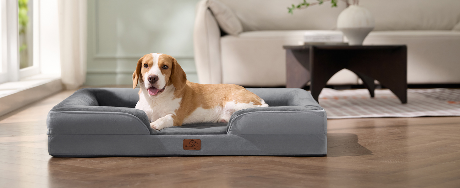 Ортопедичне ліжко для собак BEDSURE - 89x63 см. Зручне ліжко-софа для собак середніх порід, з ергономним наповнювачем, сірого кольору. Легко миється, не ковзає. Розміри: 89 x 63 x 17 см.