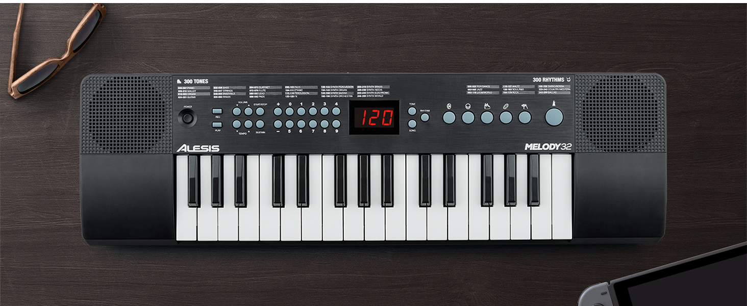 Alesis Melody 54 - Портативна клавіатура з 54 клавішами, вбудованими динаміками, 300 звуками, 300 ритмами, 40 демо-піснями, навчальними інструментами, мікрофоном та підставкою для нот (32 клавіші)