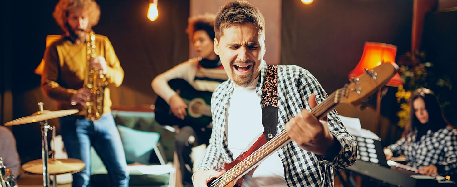 Гітарний ремінь з натуральної шкіри (2 дюйми) для акустичної, бас та електрогітари. Регулюється від 96 до 163 см. М'яка обробка деревини, коричнева квітка.