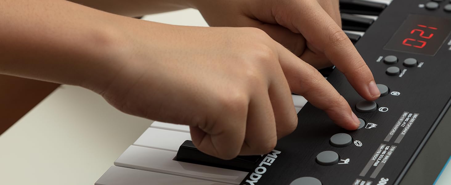 Alesis Melody 54 - Портативна клавіатура з 54 клавішами, вбудованими динаміками, 300 звуками, 300 ритмами, 40 демо-піснями, навчальними інструментами, мікрофоном та підставкою для нот (32 клавіші)