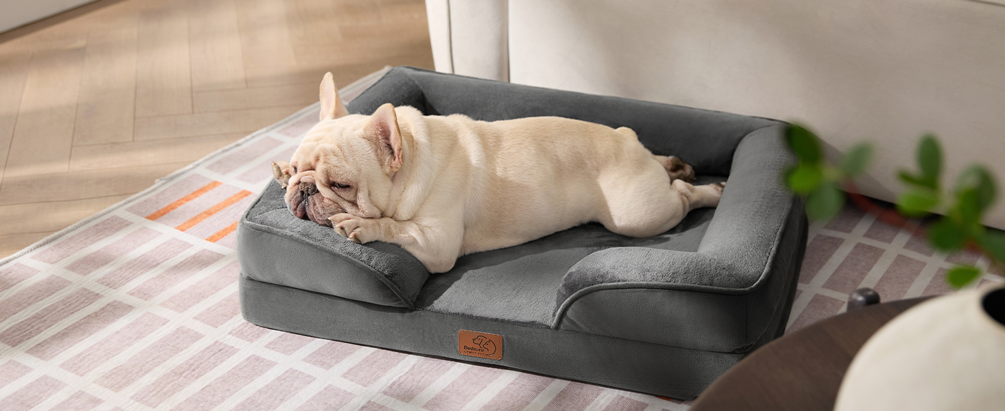 Ортопедичне ліжко для собак BEDSURE - 89x63 см. Зручне ліжко-софа для собак середніх порід, з ергономним наповнювачем, сірого кольору. Легко миється, не ковзає. Розміри: 89 x 63 x 17 см.