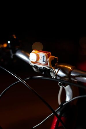 Налобний ліхтар PETZL BINDI, універсальний, помаранчевий
